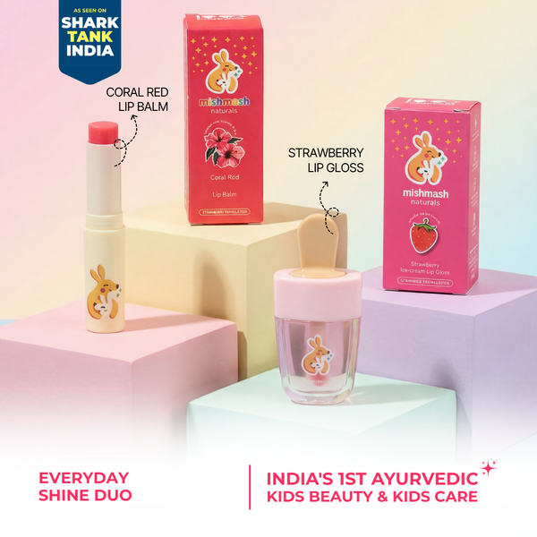 Mish Mash lip balm and lip gloss with packaging on a pastel background